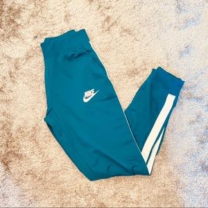 green nike track pants